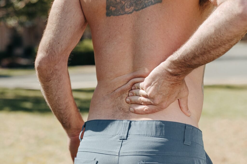 Man Touching his back shows pain