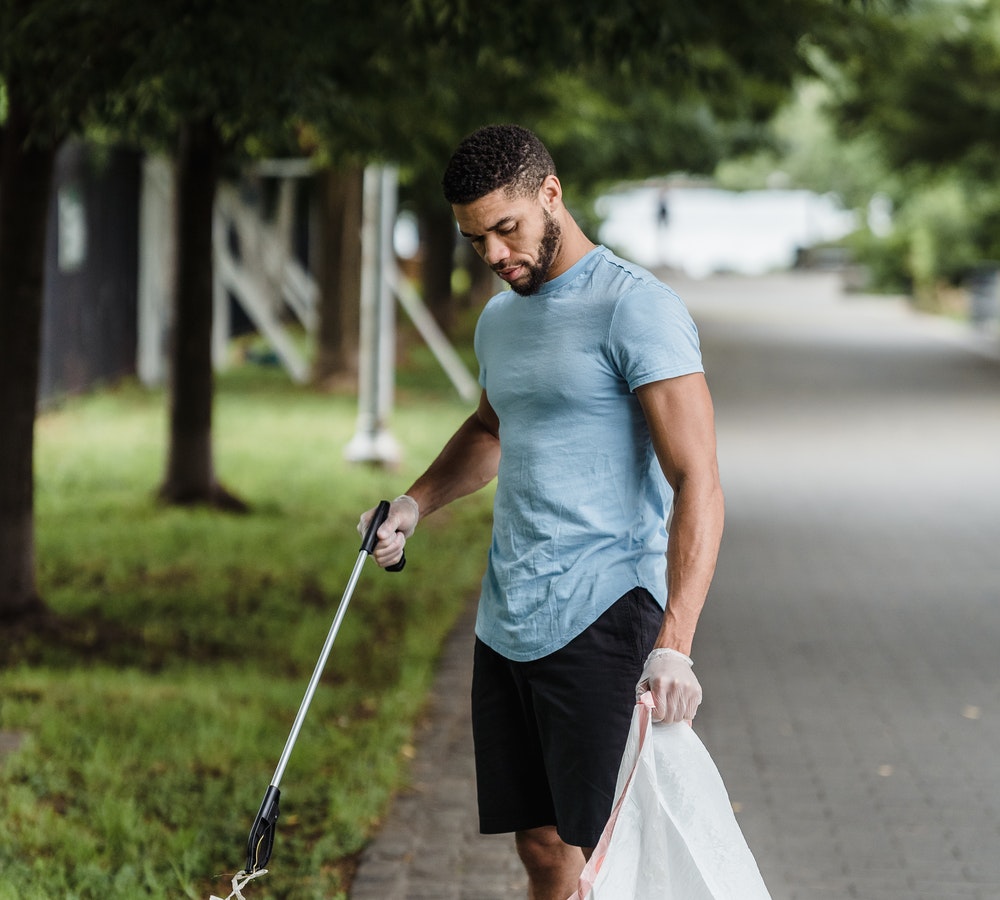 A man picking the garbage.