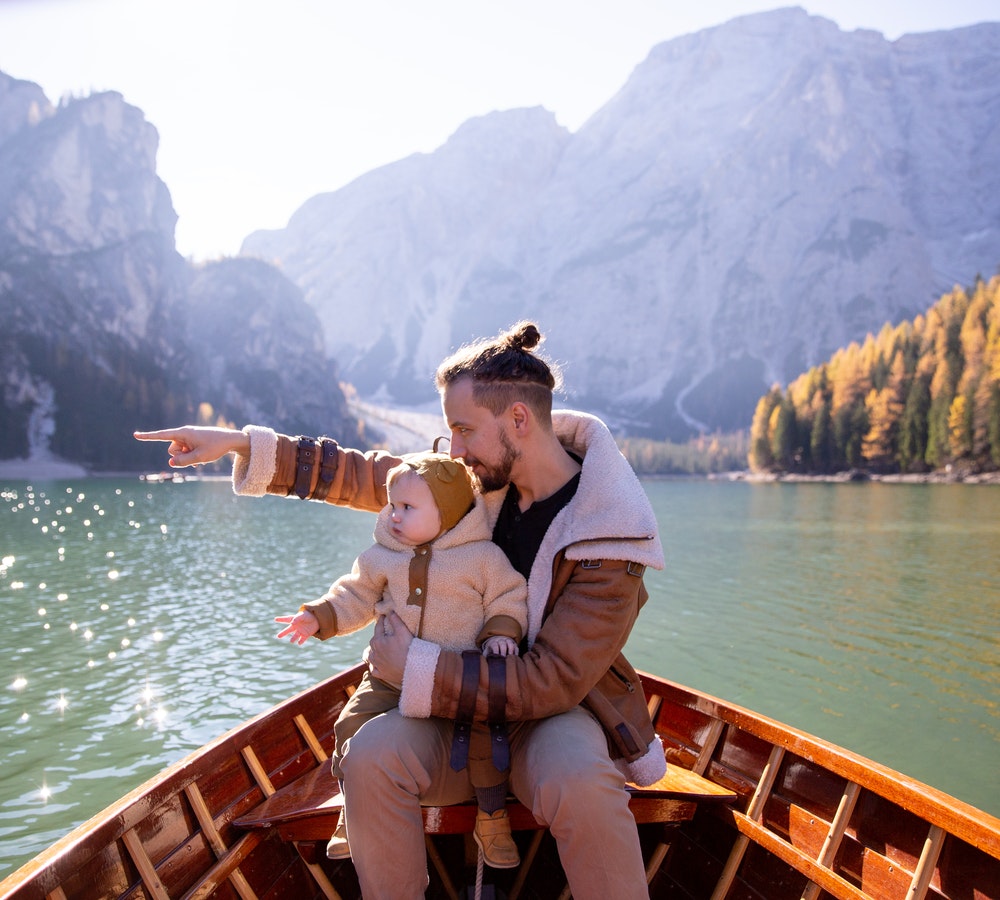 A man in a boat with his son