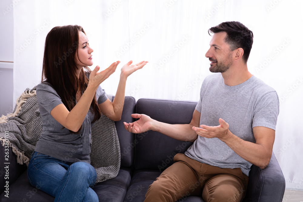 A wife sharing something with his husband.