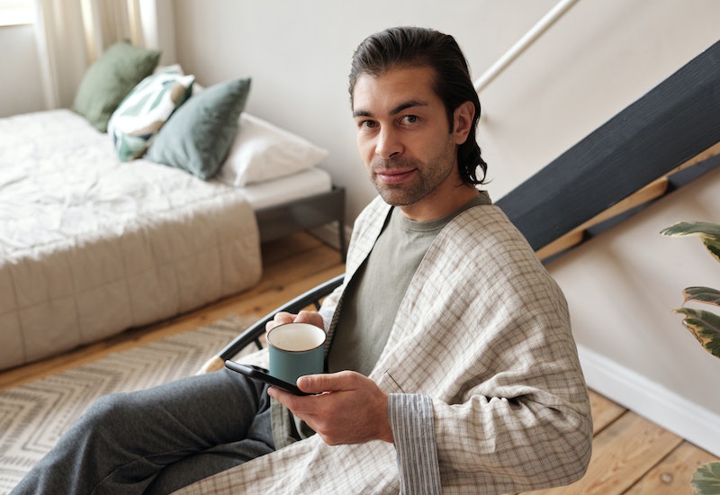 Man drinking tea before going to bed.