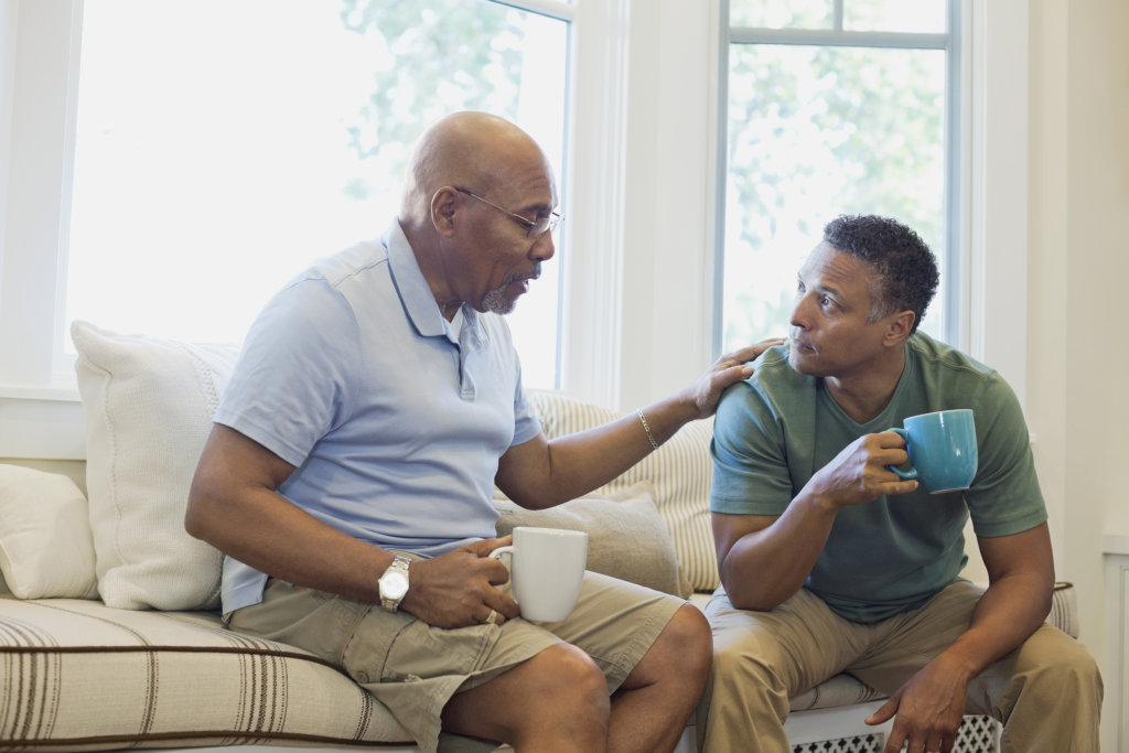 A discussion between a son and his father going on in a gentle and polite way.