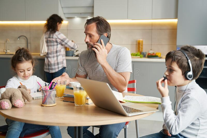 A son having a conversation with his father on phone.