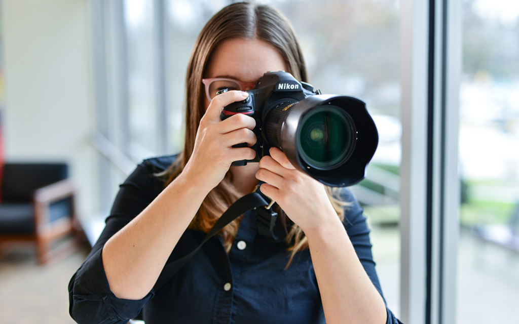 A girl taking professional photos.