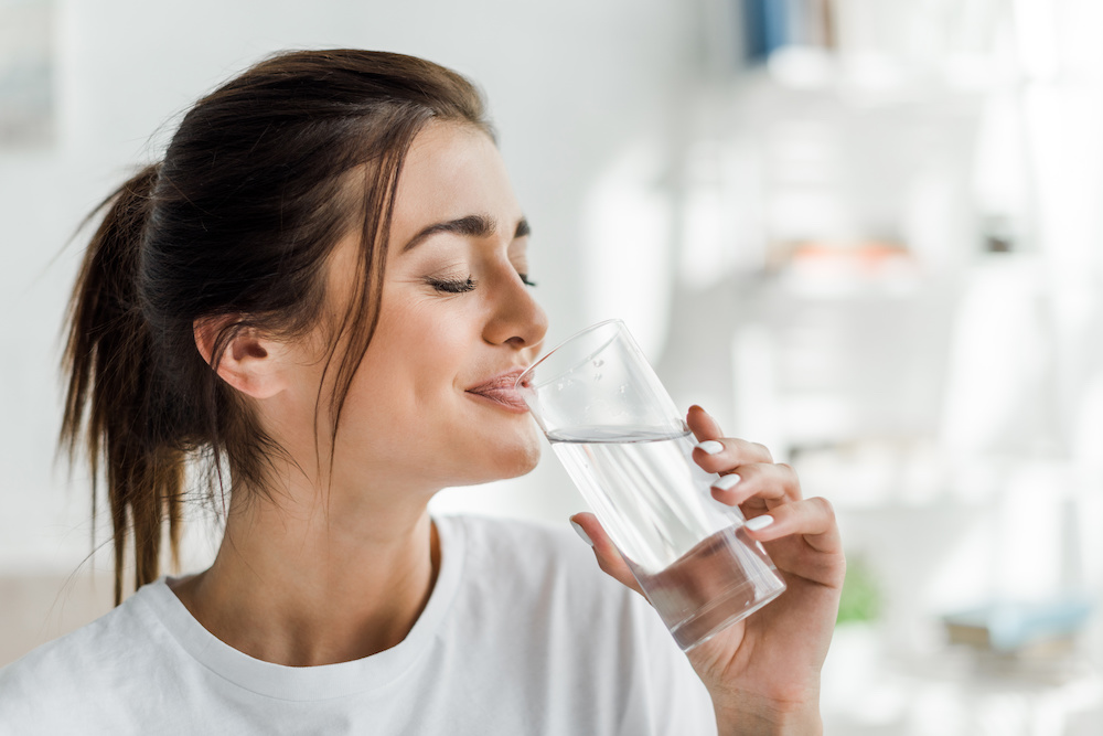 A girl drinking water.