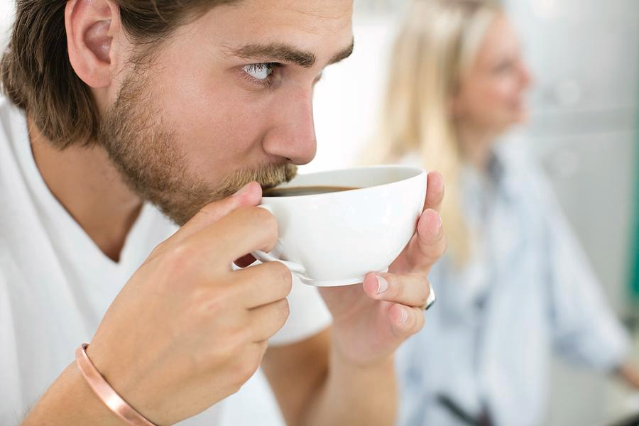 A man drinking coffee.