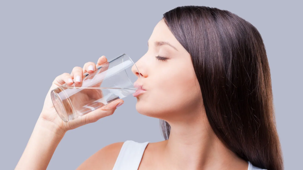 A girl drinking water.