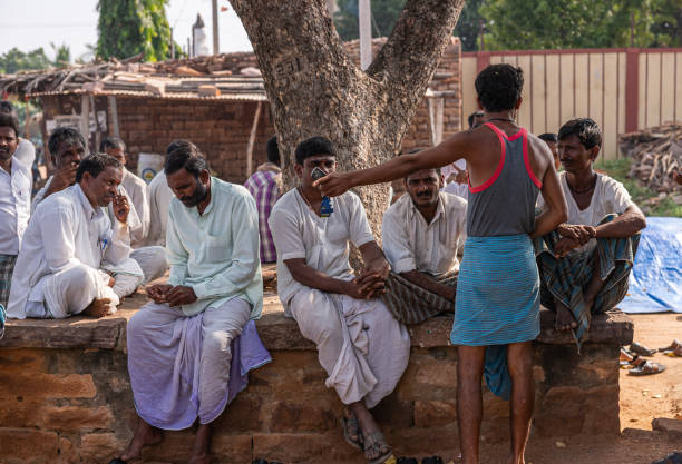 People of the village gossiping after the day's work.