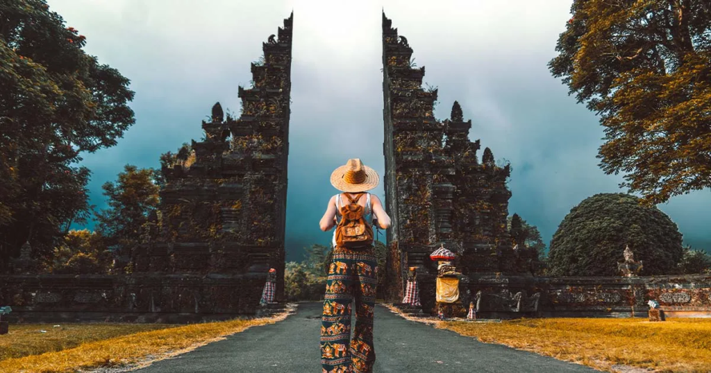 A girl walking on the road in Bali.