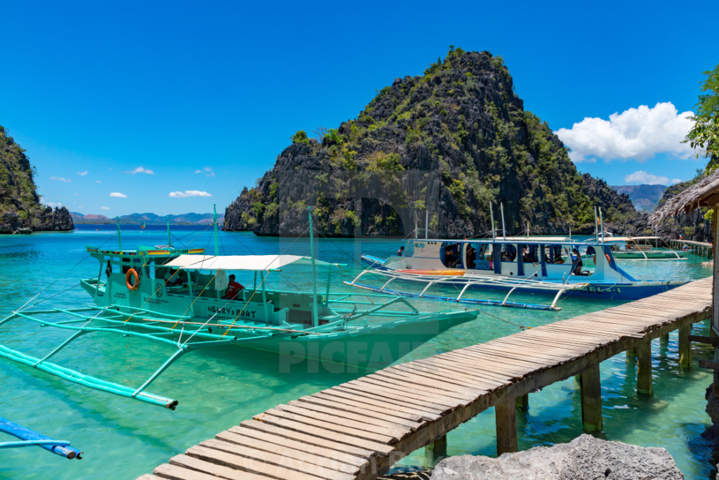 Boats sailing in the river in Philippines.