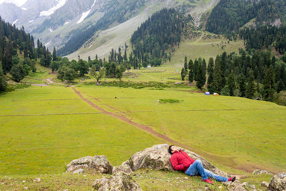 A man taking rest in the beauty of nature.