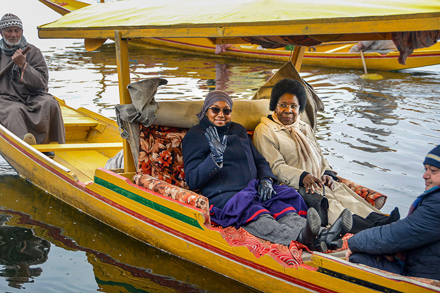 Tourists enjoying ride in Shikara.