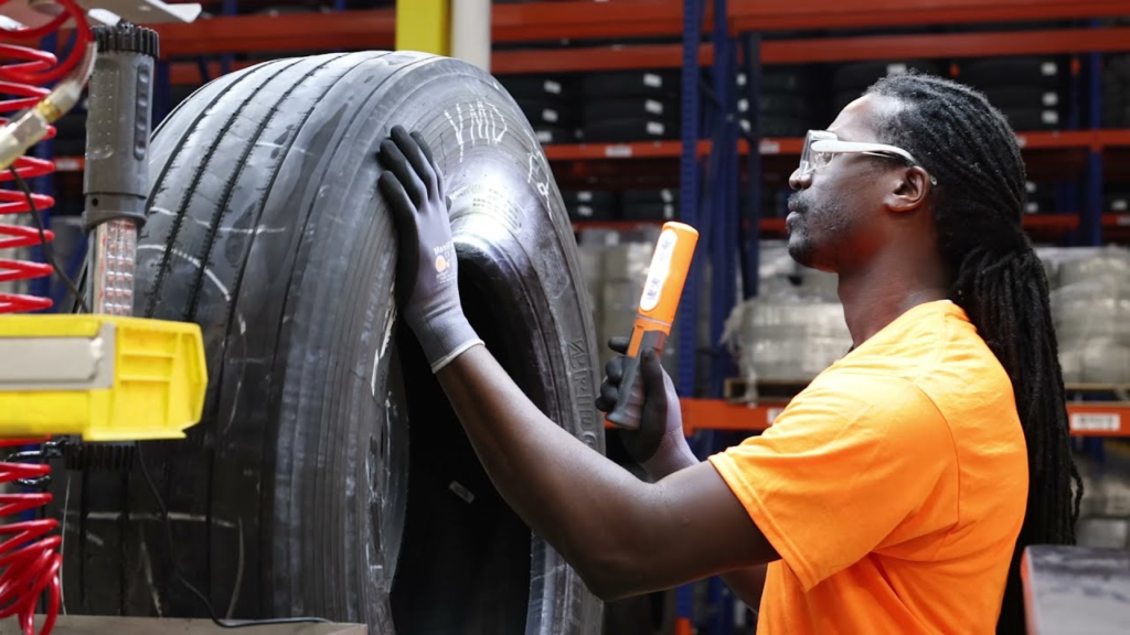 A man providing truck repairing services.